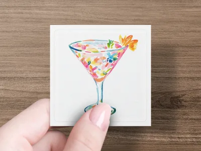 Watercolor illustration of a cocktail with fruit garnishes in a stemmed glass.