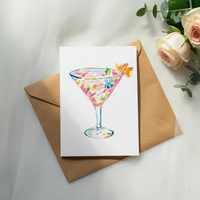 Watercolor martini glass with colorful flowers, on envelope.