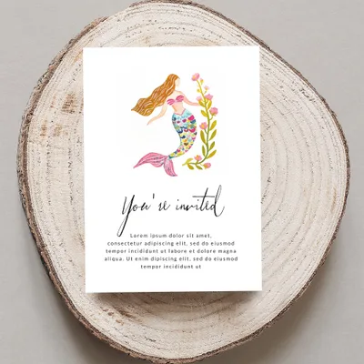 Invitation card with watercolor mermaid and floral design.