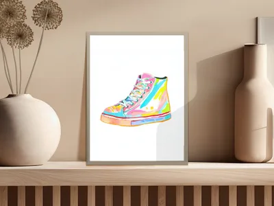Colorful high-top sneaker illustration in a framed picture on a shelf.