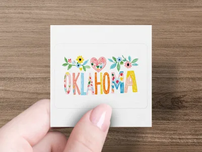 "Oklahoma" spelled with colorful floral letters on a white sticker.