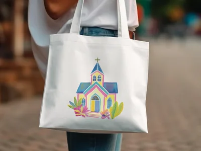 Colorful watercolor church illustration on a white canvas tote bag.