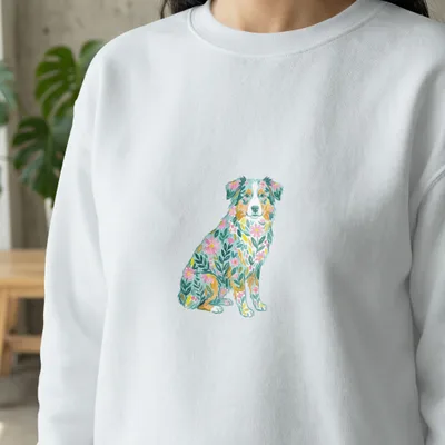 White sweatshirt with embroidered floral Australian Shepherd dog design.