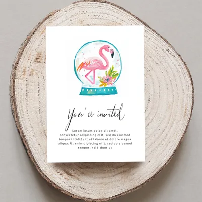 Invitation card with "You're invited" and flamingo snow globe design.
