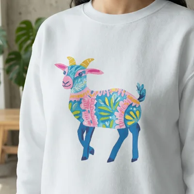 White sweatshirt with colorful floral illustrated goat graphic.
