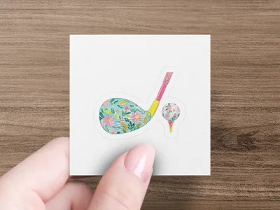 Floral golf club and ball on a tee.