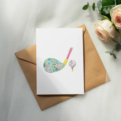 Floral golf club and ball on a greeting card with envelope and roses.
