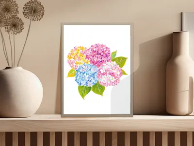 Watercolor painting of pink, blue, and yellow hydrangeas in a framed artwork.