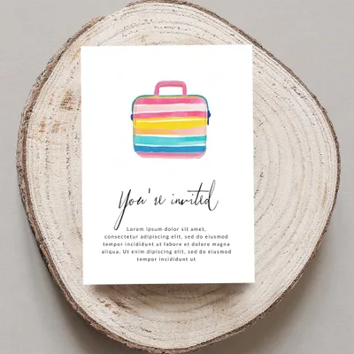 Invitation with watercolor suitcase graphic and placeholder text.