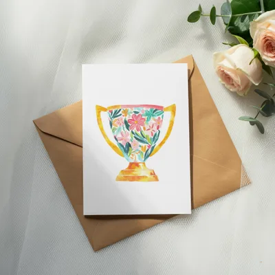 Card with floral trophy illustration on a brown envelope, with roses.
