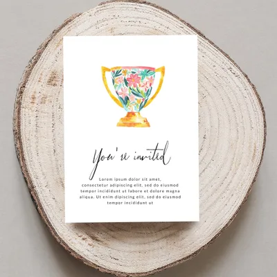 Invitation card with floral trophy and "You're invited" text.