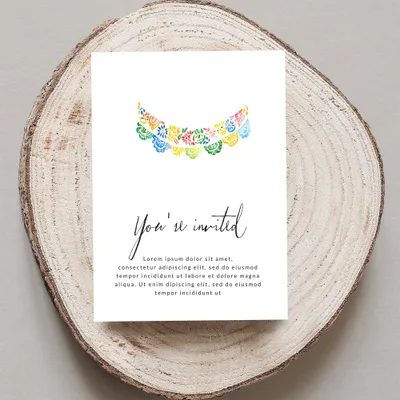 Invitation card with "You're invited" text and floral garland.