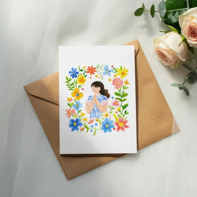 Card with woman in floral border on brown envelope, with roses.