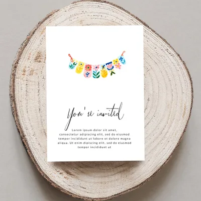 Invitation with colorful garland, text "You're invited" and placeholder copy.
