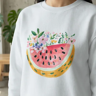 White sweatshirt with watercolor watermelon slice and floral design.