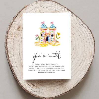 Watercolor sandcastle invitation with "You're invited" text.