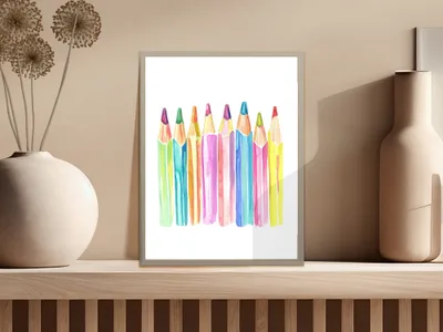Colorful watercolor pencils arranged in a horizontal row on a shelf.