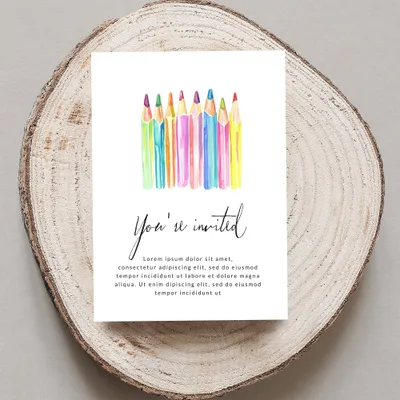 Invitation card with watercolor pencils and "You're invited" text.