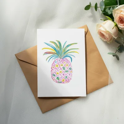 Watercolor pineapple art on card with pink roses and eucalyptus.