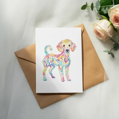 Watercolor poodle illustration on a white card, with a brown envelope.