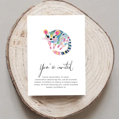 Colorful illustrated raccoon on an invitation with "You're invited" text.
