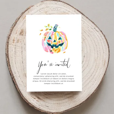 Colorful watercolor pumpkin invitation with "You're invited" text.