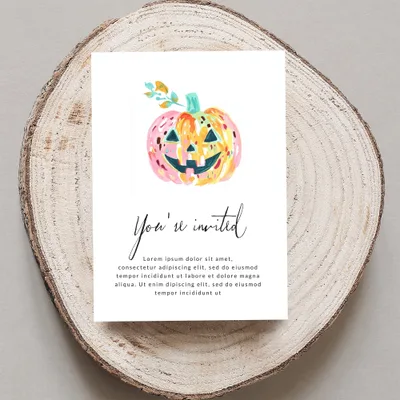 Halloween invitation with watercolor pumpkin and "You're invited" text.