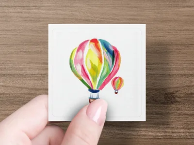 Colorful hot air balloons floating on a white square background.
