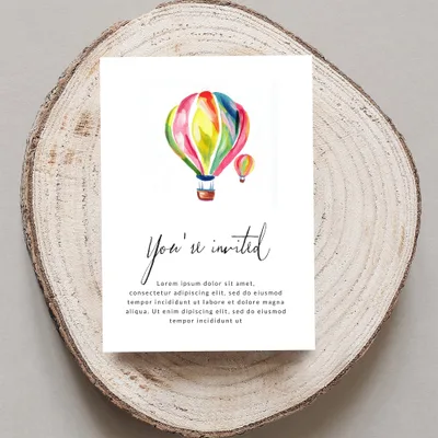 Invitation with colorful hot air balloons and "You're invited" text.