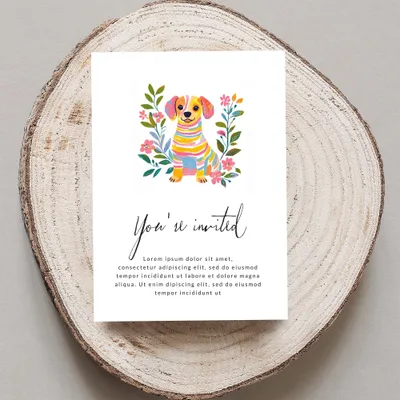 Invitation with a watercolor dog and floral border, "You're invited" text.