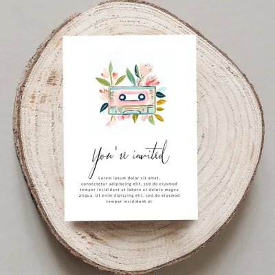 Invitation card with floral cassette tape design and "You're invited" text.