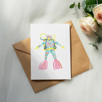 Card featuring a watercolor illustration of a scuba diver with a floral pattern.