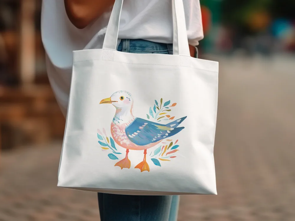 White tote bag with watercolor seagull and leafy branches design.