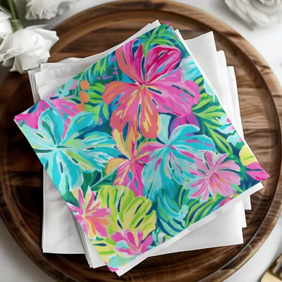 Bright floral pattern napkins on a wooden plate.