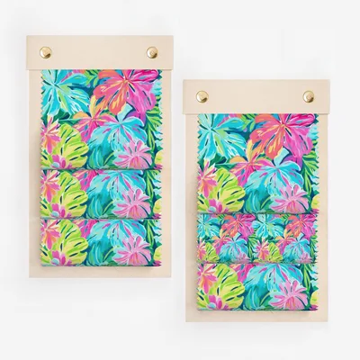 Two fabric swatches with a vibrant tropical leaf print.