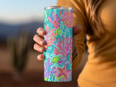 Ocean-themed tumbler with coral, starfish, and seashells.