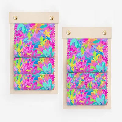 Two fabric swatches with a colorful, abstract floral pattern.