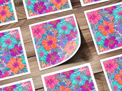 Multiple square cards featuring a vibrant hibiscus floral pattern on a wooden surface.