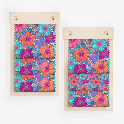 Two fabric swatches with vibrant hibiscus floral patterns.