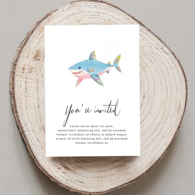 Shark invitation card with "You're invited" text.