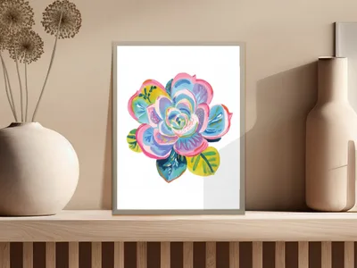 Colorful succulent painting in a silver frame on a shelf.