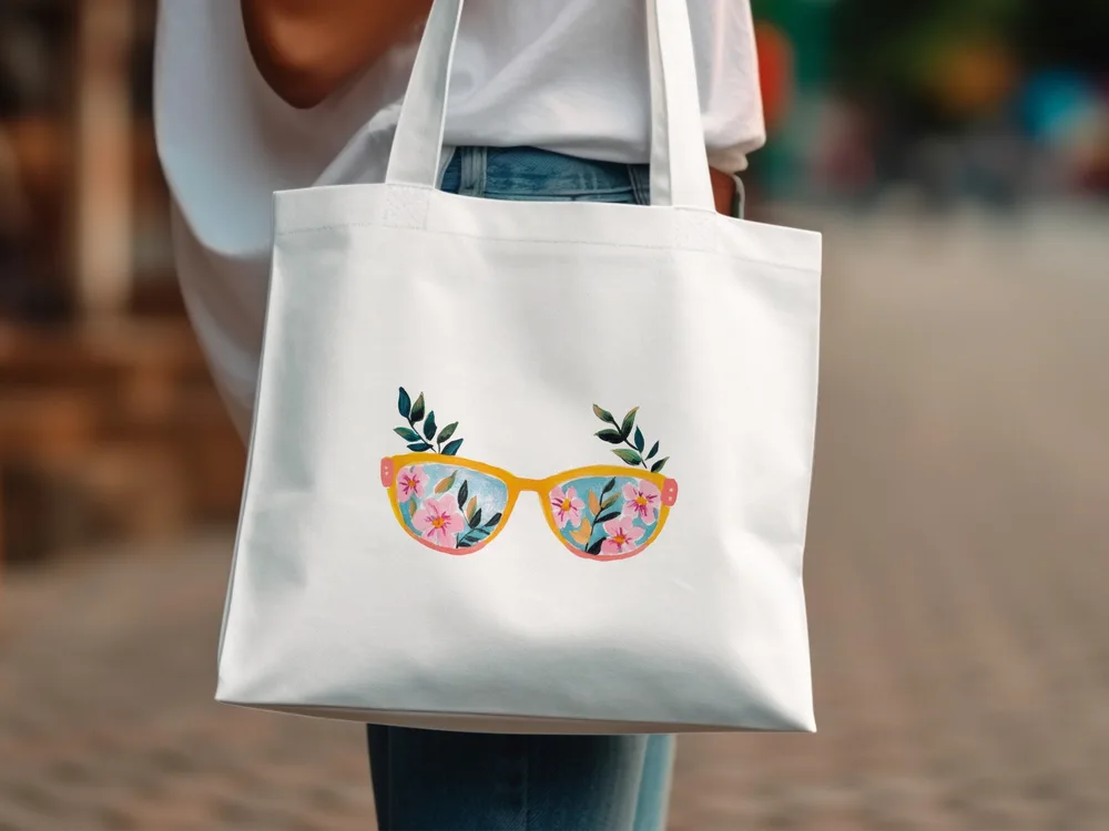 White tote bag with pink sunglasses featuring floral designs.