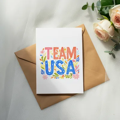 Card with "TEAM USA" in colorful, floral lettering on an envelope.