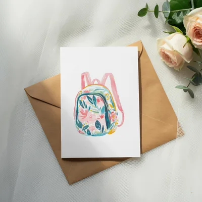 Watercolor floral backpack illustration on an open envelope with roses.