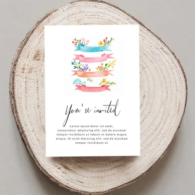Invitation with "You're invited" text and floral banners.