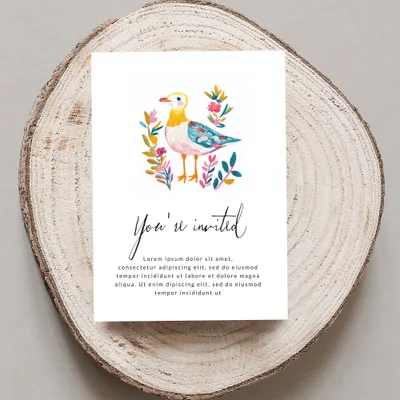 Invitation with a watercolor bird and floral design, reads "You're invited" and placeholder text.