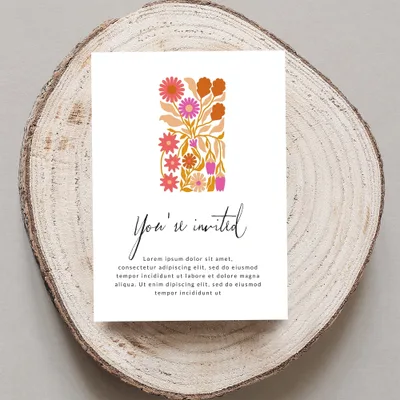 Invitation card with floral design and "You're invited" text.