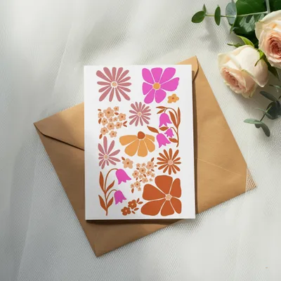 Card with retro floral illustrations on a kraft envelope.