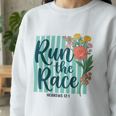 White sweatshirt with "Run the Race" text and floral design, Hebrews 12:1.