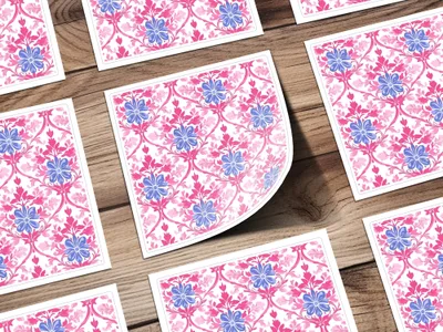 Floral pattern with pink and blue flowers on a wooden background.